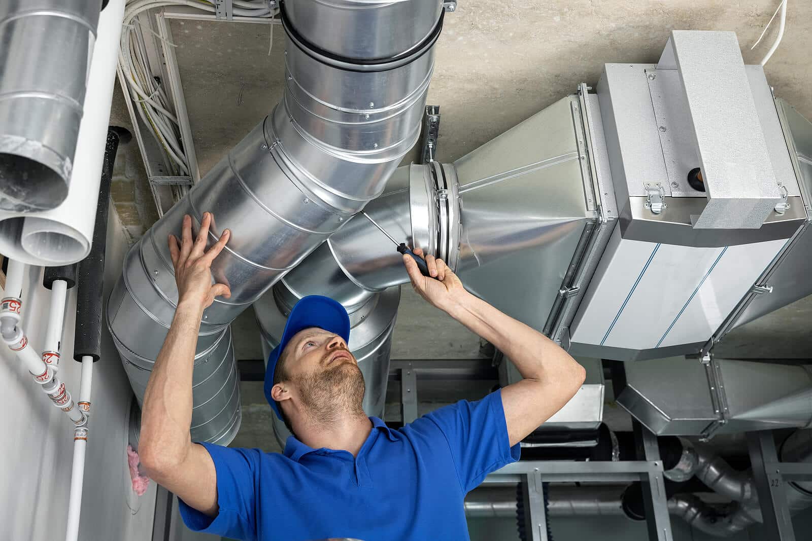HVAC technician inspecting and repairing air ducts in Mountain View