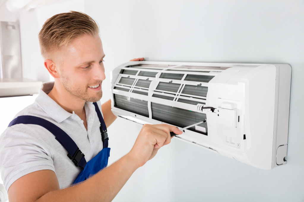 HVAC technician maintaining a ductless air conditioner in Mountain View