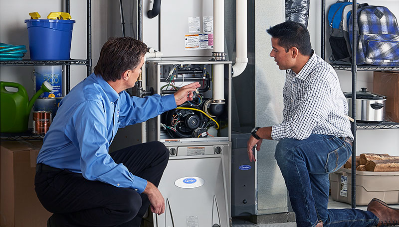 Technician evaluating a furnace for repair or replacement in Mountain View