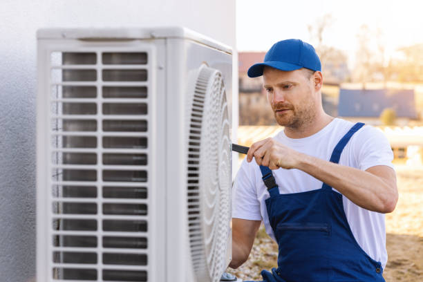 HVAC technician servicing an outdoor air conditioner in Mountain View