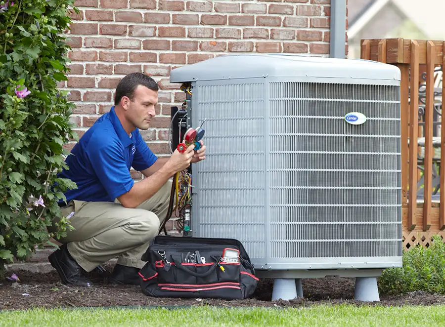 HVAC technician inspecting an outdoor AC unit in Mountain View
